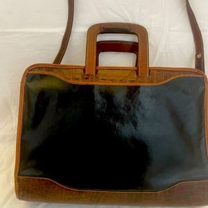 Brahmin briefcase, black leather with croc-embossed cognac colored leather.
